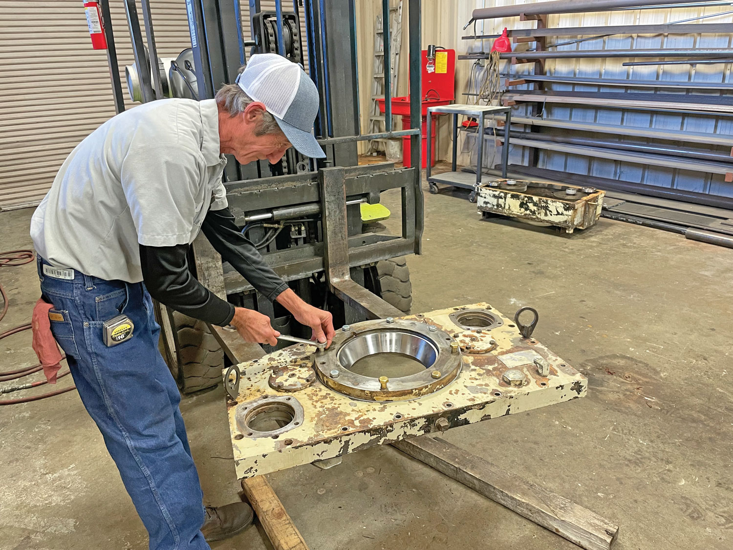 Service Technician Hays Browning rebuilds parts of a drill rig, including a top head from a legacy DM2500.